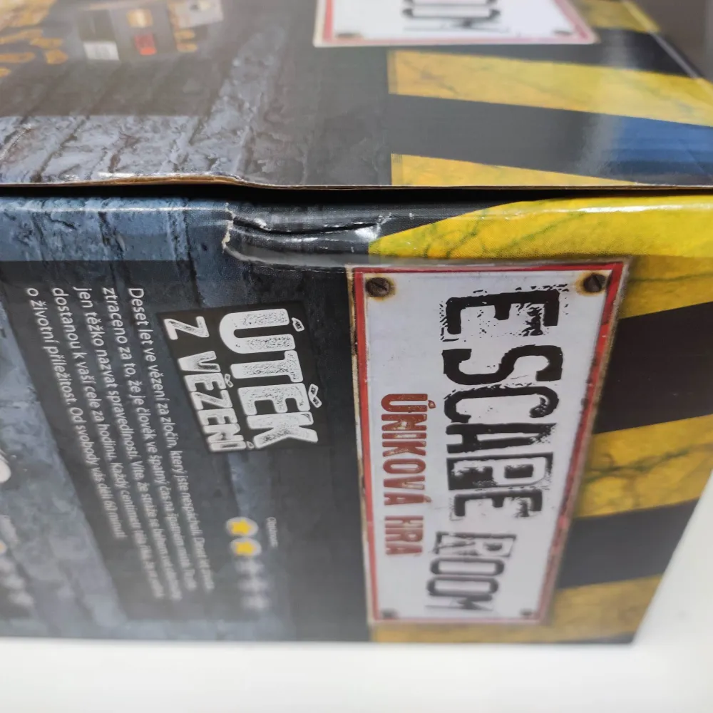 Escape Room - úniková hra - poškozený obal