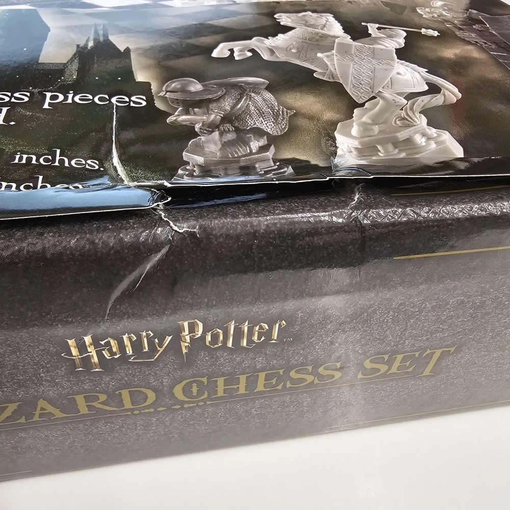 Kouzelnické šachy Harry Potter - poškozený obal