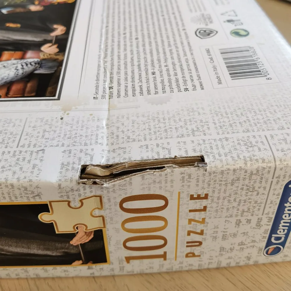 Puzzle Harry Potter v kufríku, 1000 dielikov - poškodený obal